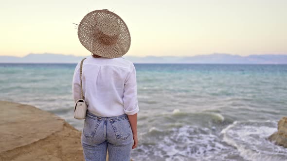 Stranger Woman Standing on Beach Near Mediterranean Ionian Sea