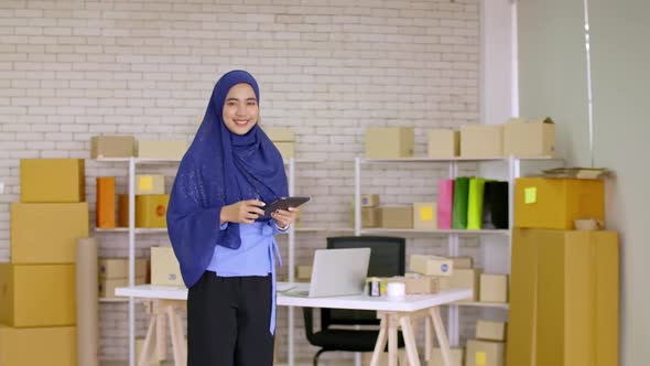 Young Muslim woman with start up small business entrepreneur freelance working at home