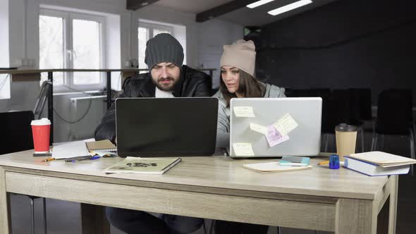 Young Man and Woman Working in Creative Office