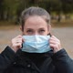 Woman Putting on Medical Mask for Coronavirus Protection Outdoors - VideoHive Item for Sale