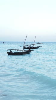 Vertical Video Boats in the Ocean Near the Coast of Zanzibar Tanzania