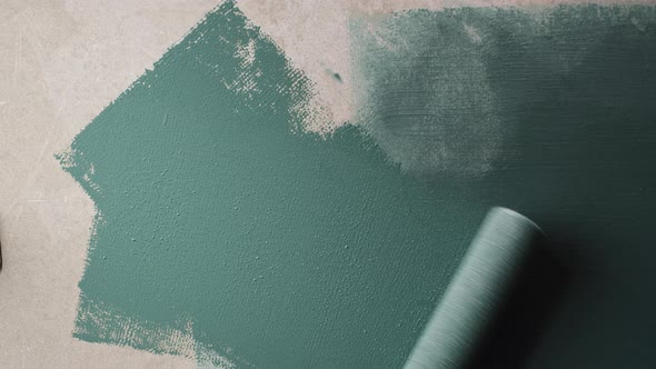 Renovation Painting Walls with Blue Paint Using Brush Closeup