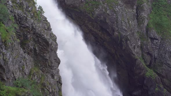 Cascading Water Flowing Down Rocks Into River