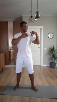 Hand Held Shot of AfricanAmerican Man Doing Shoulder Rotation Exercise During Working Out