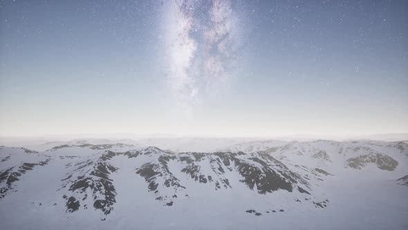 Milky Way Above Snow Covered Terrain alt