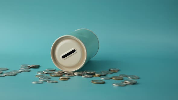 Saving Coins Jar and Calculator on Table