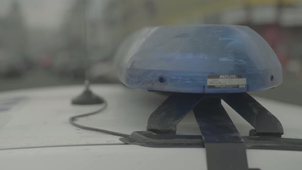 Flashing Flasher on the Roof of a Police Car. Blinker. Close-up.