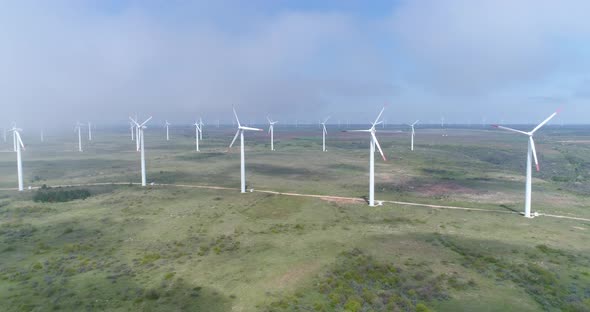 4K aerial wiev of windmills farm. Modern wind turbines.