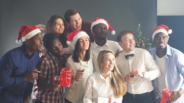 Smiling Group Of Friends Celebrate Evening Event With Selfie At Christmas Party.