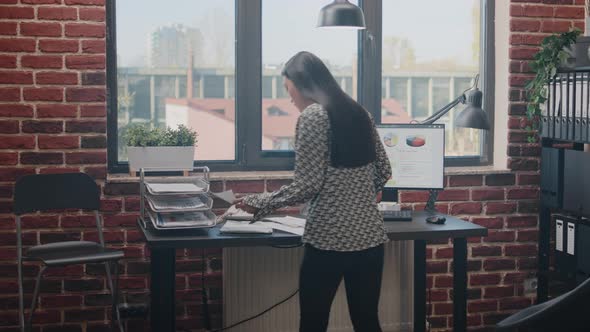 Close Up of Entrepreneur Using Papers to Design Business Charts