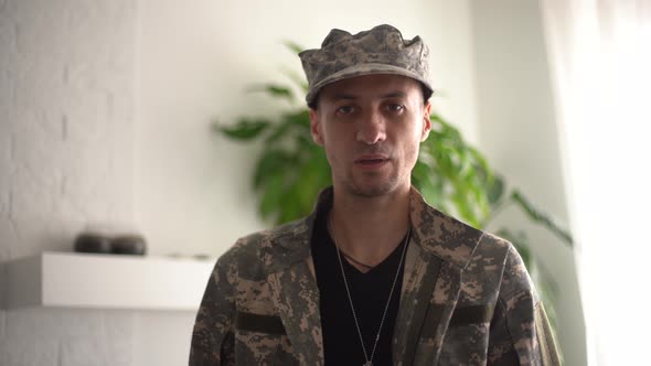 Serious Responsible Young Guy Looking at Camera Listening Order with Confidence Discipline