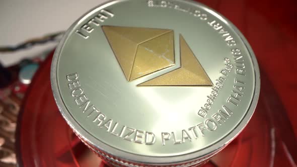 Silver and Gold ETHERIUM ETH Coin Rotate on Videocard Very Close Up Shot