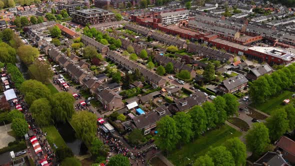 Aerial View Of People Walking In The Street With King’s Day Market In Hendrik-Ido-Ambacht, Netherlan