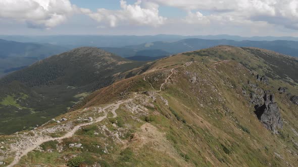 Mountain Ridge Under Blue Cloudy Sky