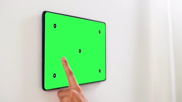 Hand Touching Tablet Pc Green Screen at Smart Home