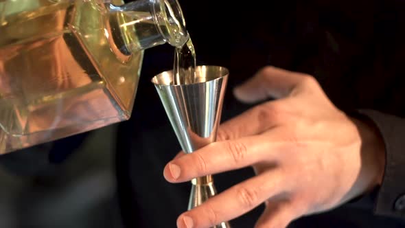 the bartender prepares a cocktail. close-up.