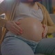Unrecognizable Pregnant Young Woman Uses Ointment or Body Lotion - VideoHive Item for Sale