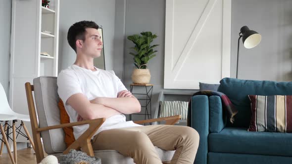 Man Sitting on Couch and Relaxing