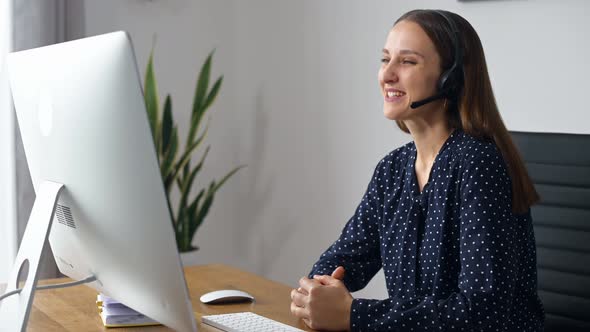 Woman is Using Headset for Online Communication