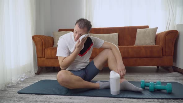 A Man Rests After Sports Drinks Sports Nutrition From a Shaker