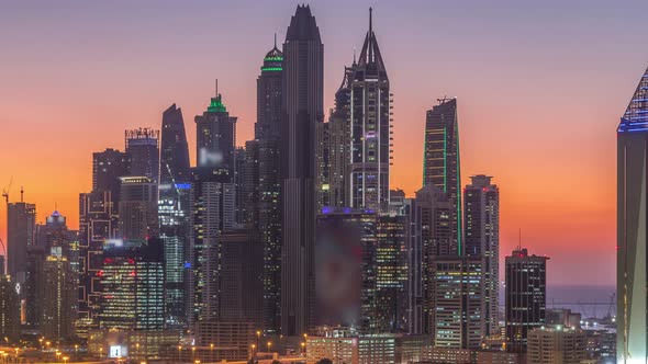 Dubai Marina Skyscrapers and Golf Course Day to Night Timelapse Dubai United Arab Emirates