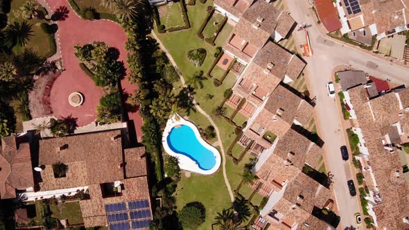 Overhead View Of Holiday Hotels With Swimming Pool On A Sunny Summer Day In Estepona, Costa del Sol,