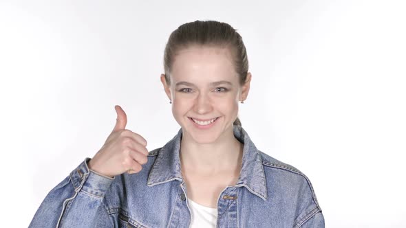 Portrait of Casual Young Woman Gesturing Thumbs Up