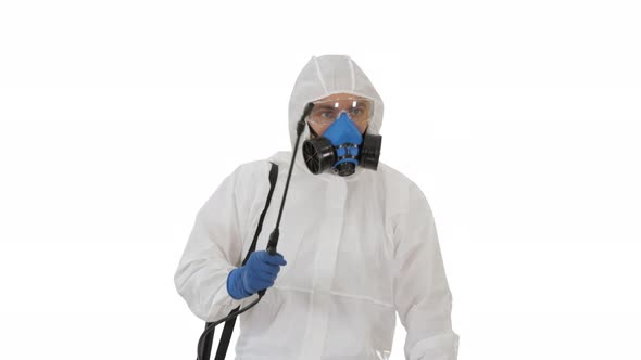 Virologist in Protective Uniform Walking and Disinfecting the Area on White Background