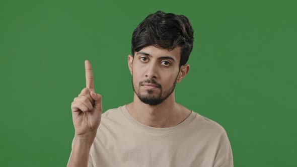Upset Serious Arabic Guy Looks at Camera Shakes Index Finger Shows Never Gesture Denies Forbids