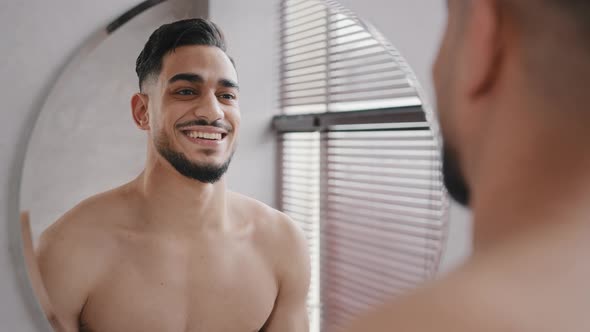 Close Up Male Reflection in Mirror Handsome 30s Unshaven Confident Arabian Indian Bare Naked Man in