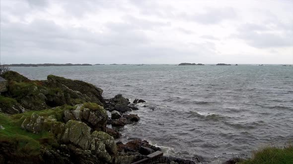 Panning Shot of the Rocky Shores of Loch Uigeadail in Islay