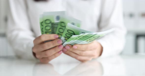 Businesswoman Counts Cash One Hundred Euro Banknotes