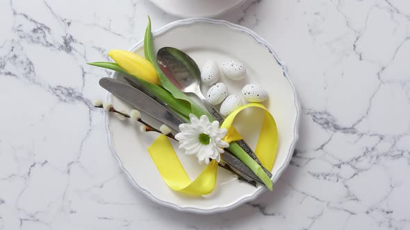 Spring Easter Table Setting at White Marble Table. Top View