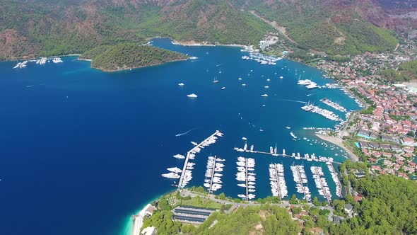 Small City Houses, Beautiful Marina and Touristic Boats in a Cove Surrounded by Forest by Sea