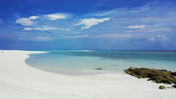 Tropical overhead travel shot of a white paradise beach and blue water background in best quality 4K