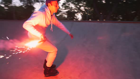 Aggressive Inline Roller Skater Doing Tricks in Concrete Skatepark with Red Burning Signal Flare