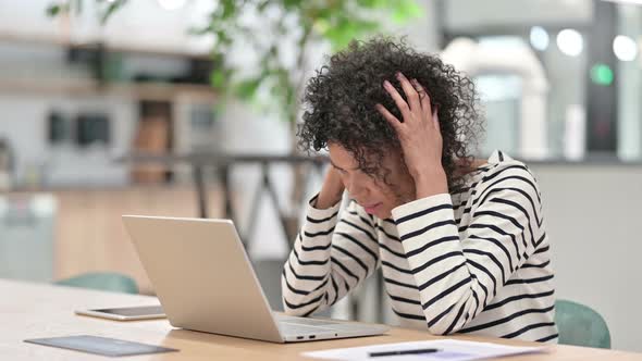 African Woman Reacting To Failure on Laptop in Office