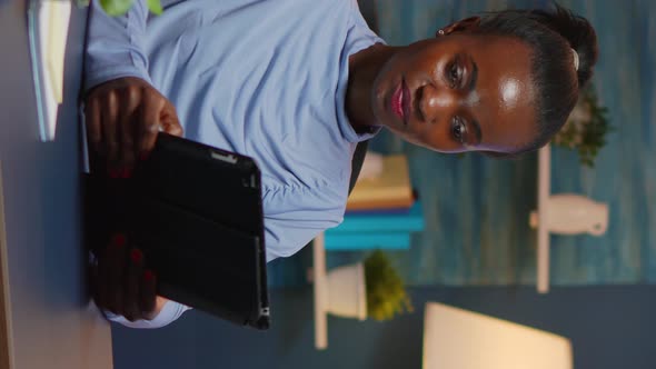 Vertical Video African American Businesswoman Taking Break Using Tablet