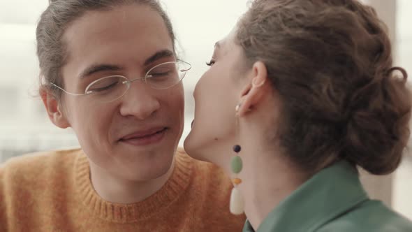 Woman Kissing Man on Cheek