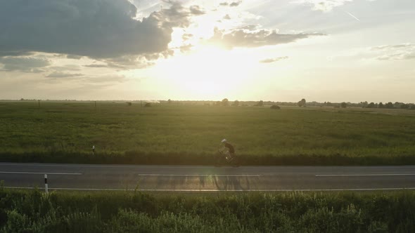 Sportsman is Riding a Bicycle Fast