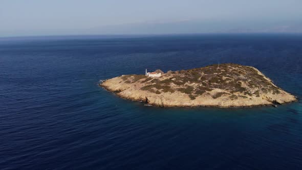 Around the Small Island with Old House Surrounded By Sea