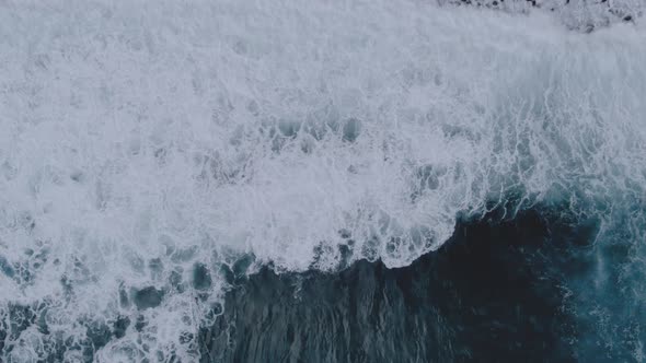 Aerial view of waves crashing along the coast, Madeira, Portugal.