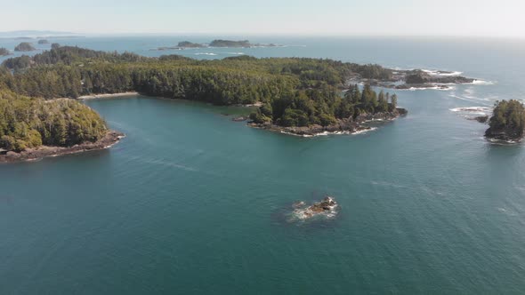 Aerial, smooth view above Vancouver Island in 4K. Ocean, rocks, forest, seaside. Ucluelet, British C