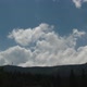 Time-lapse of clouds on blue sky over mountain - VideoHive Item for Sale