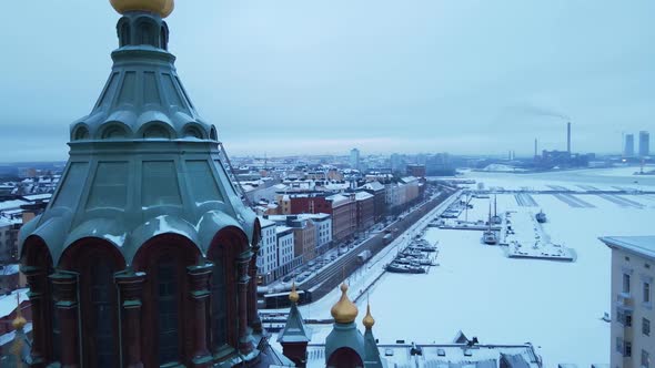 Flying Past the Uspenski Cathedral Revealing Helsinki City in the Winter