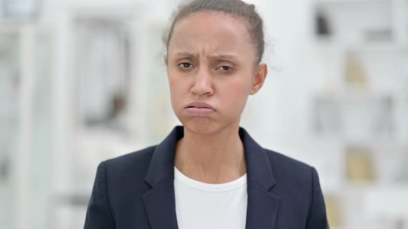 Portrait of African Businesswoman Saying No By Head Shake 