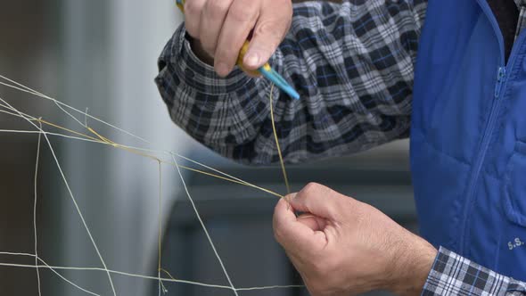 Fisherman Is Repairing Fishnet 2