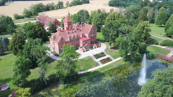 Jaunmoku Brick Medieval Castle Near Tukums, Latvia  Aerial Dron 4k Shot Jaunmokas Manor Park.