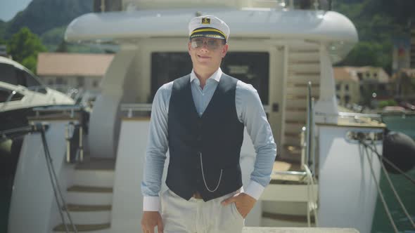 Captain standing in front of boat
