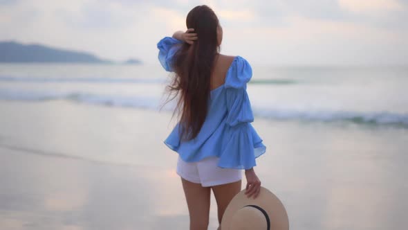 Asian woman enjoy around beautiful beach sea ocean